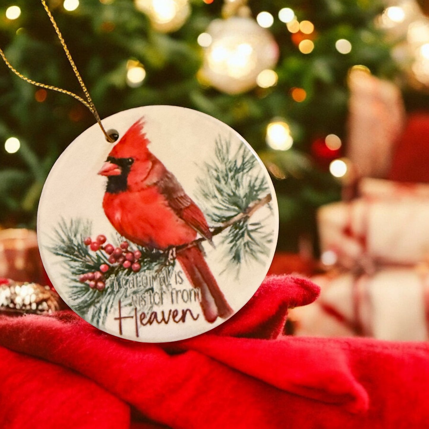 A cardinal is a visitor from heaven ornament